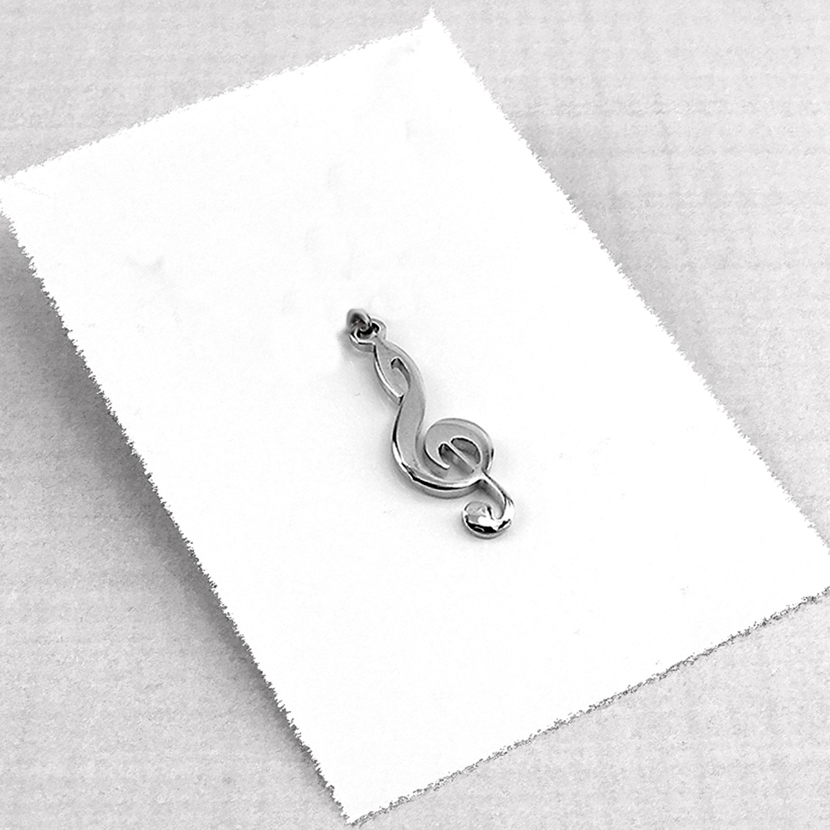 899Z Sol anahtarı müzik çelik kolye   (25x10mm) 